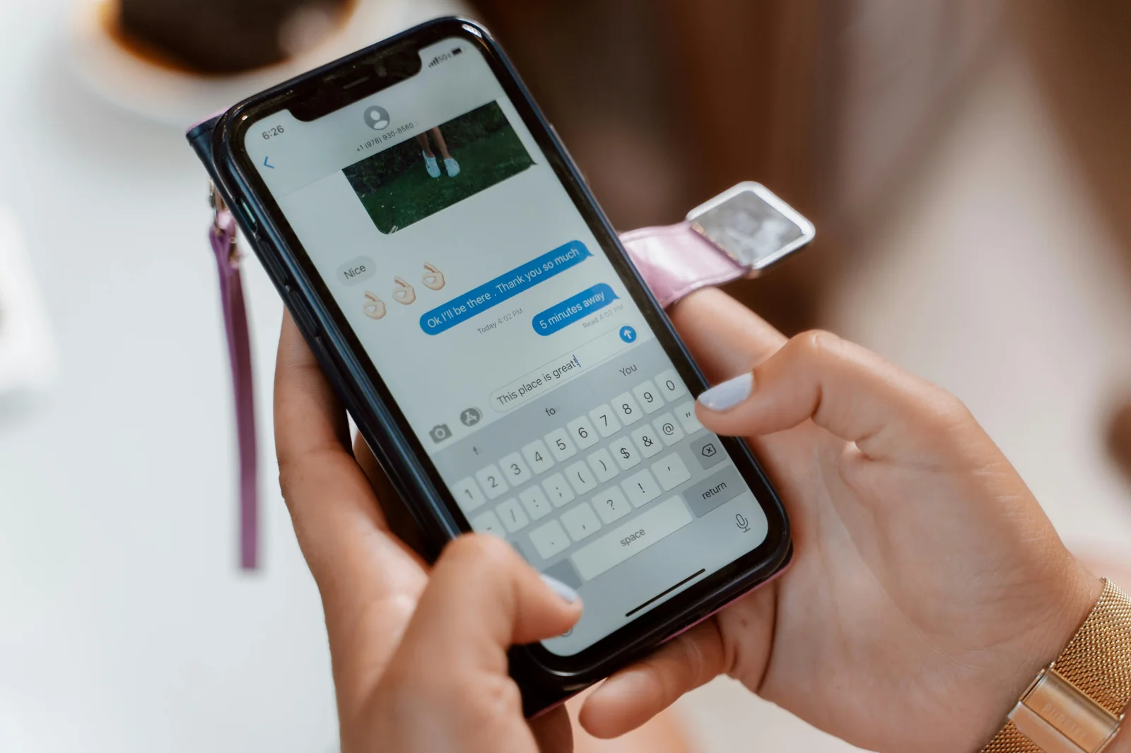 Person typing a text message on a smartphone