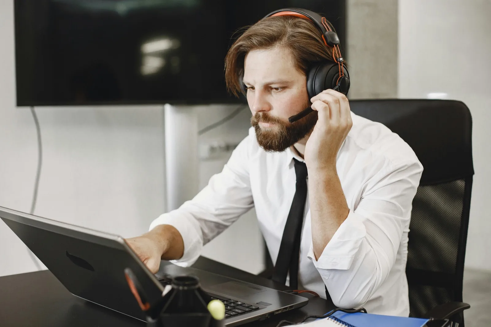 Sales professional on a laptop during a browser-based business call