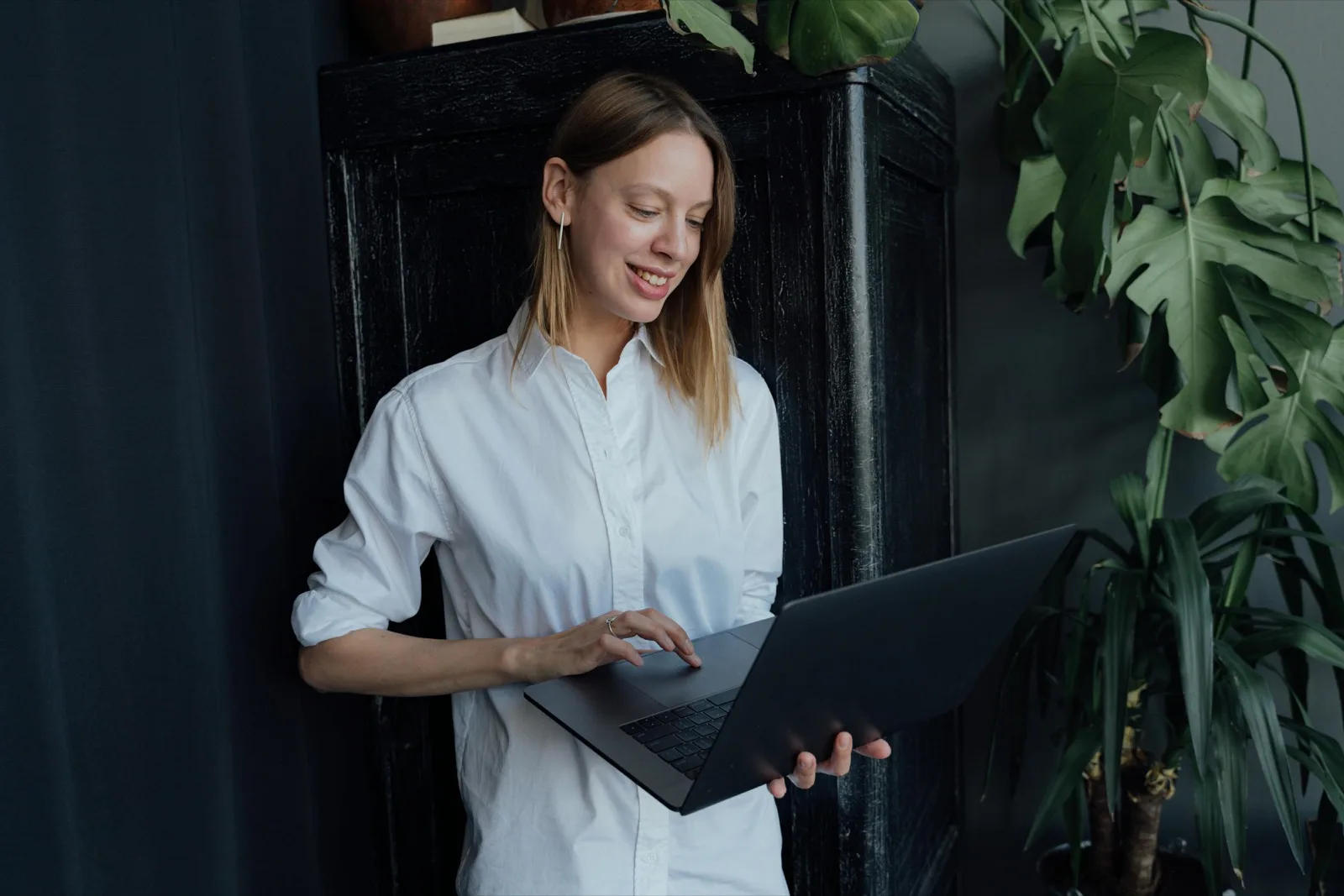 Professional working on a laptop in a modern home office