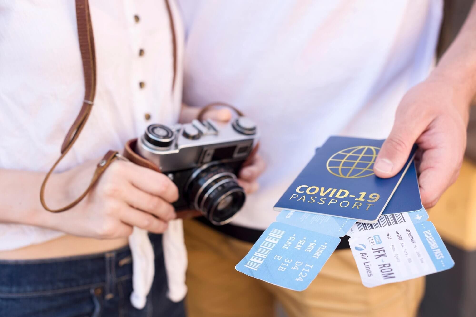 Travelers photograph their passports and boarding documents before a trip.